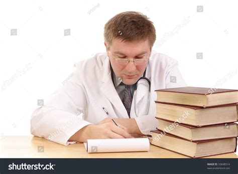 Young Male Doctor Studying Medical Books Stock Photo 10698514