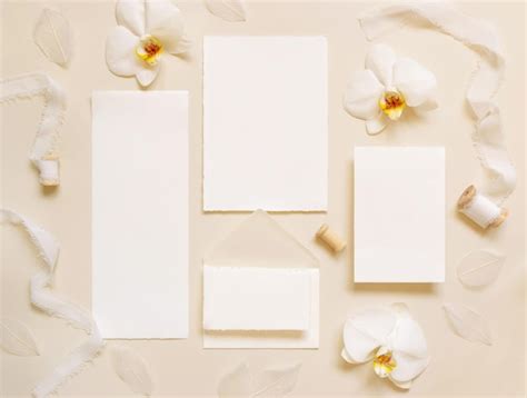 Premium Photo Wedding Cards Near White Orchid Flowers And Silk