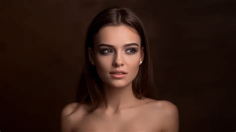women face bare shoulders looking away brunette implied nude portrait simple background