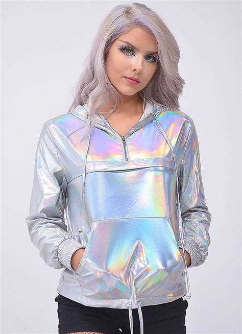 A Woman With Grey Hair Wearing A Holographic Jacket And Fishnet Tights