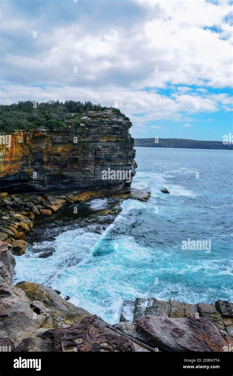 Jagged Rocky Cliffs Facing The Sea Stock Photo Alamy