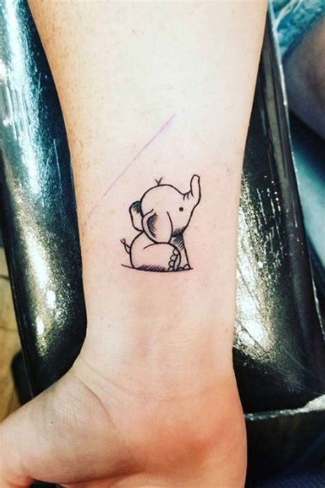 There is an elephant head in the middle of the design, and overall it's a pretty great design. 16 Adorable, Tiny Elephant Tattoos That You'll Never ...