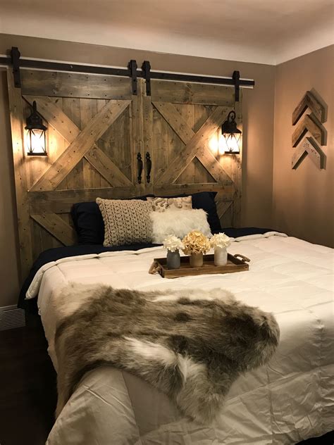 This is a cirrus hugger ceiling fan in gloss white. Rustic barn door headboard | Farmhouse bedroom decor