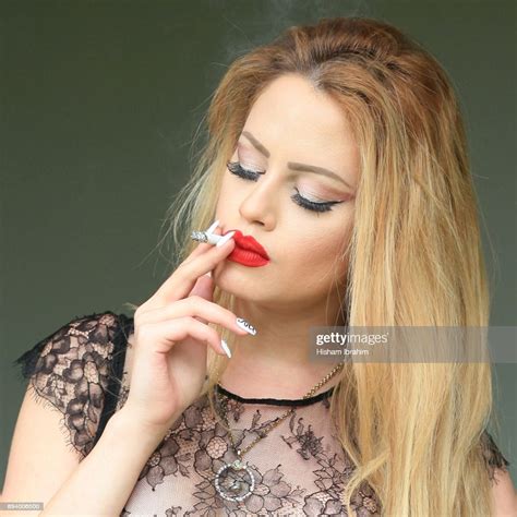 Glamorous Young Beautiful Latin Woman Smoking Cigarette