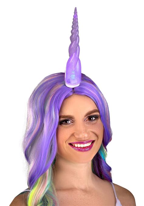 A Woman With Purple Hair Wearing A Unicorn Horn