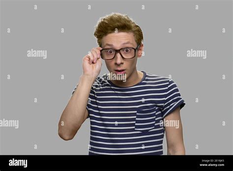 Nerd Boy In Eyeglasses With Surprised Facial Expression Stock Photo Alamy