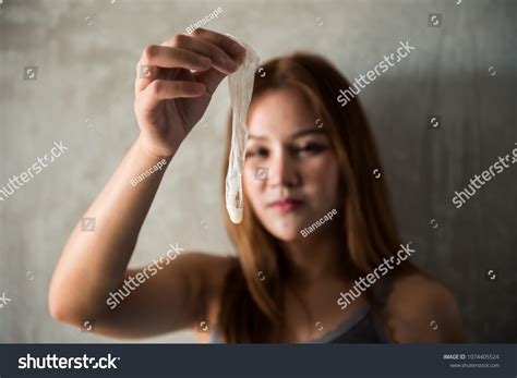 Photo De Stock Asian Female Hand Holding Used Condom 1074405524