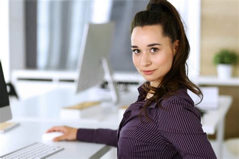 Business Woman Using Computer At Workplace In Modern Office Brunette