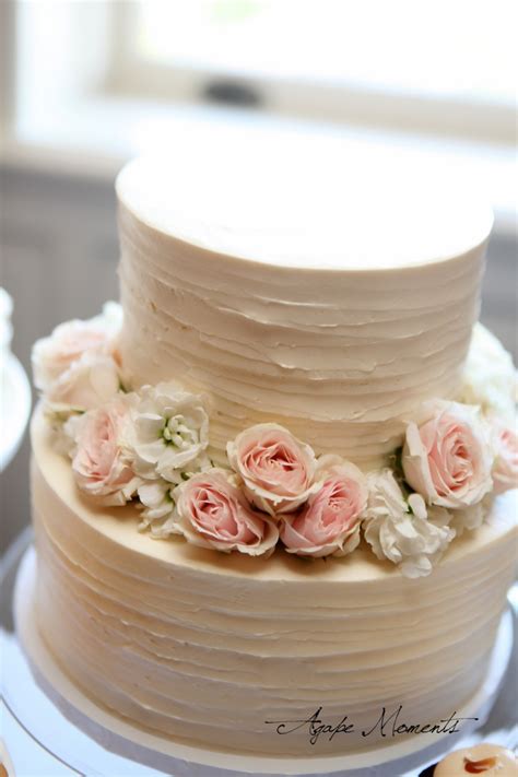 Tiered cake with delicate mini flowers: cocoa & fig: Minneapolis Wedding Miniature Dessert Table ...