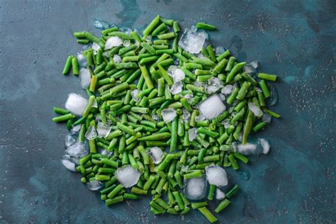 Frozen Green Beans With Ice Cubes On Color Background Stock Image