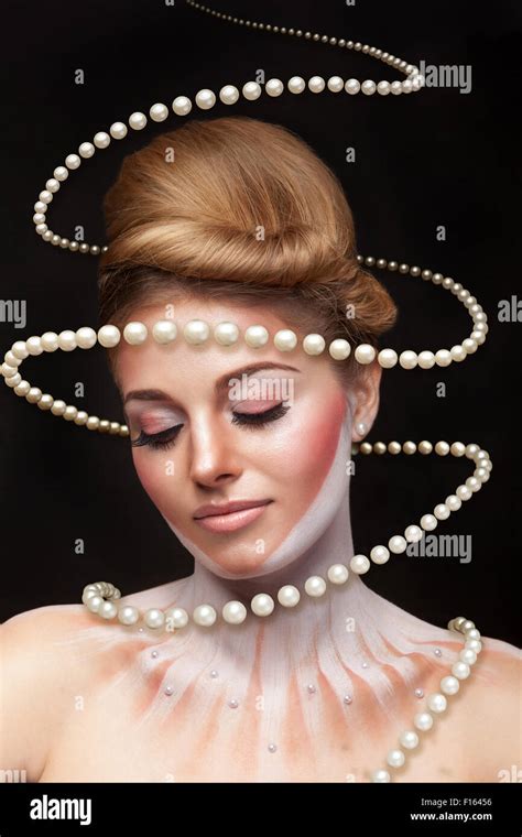 Surreal Art Concept Of Girl With Pearls Arround Her Studio Shooting