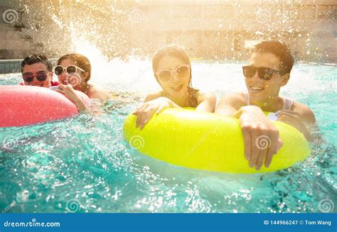 Friends Playing In Swimming Pool On Summer Vacation Stock Image Image