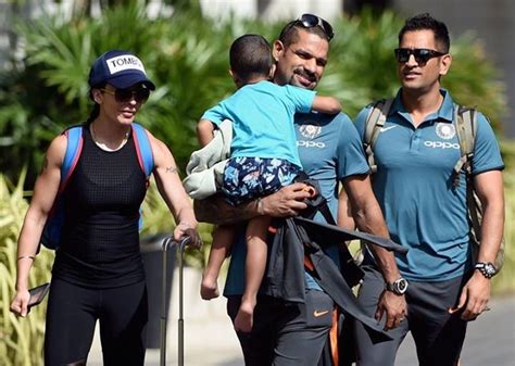 The cricketer posed with his son for a picture wherein both can be seen clad in face masks. MS Dhoni accompanies Shikhar Dhawan who is moving along ...