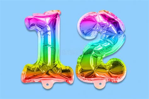 Rainbow Foil Balloon Number Digit Twelve On A Blue Background