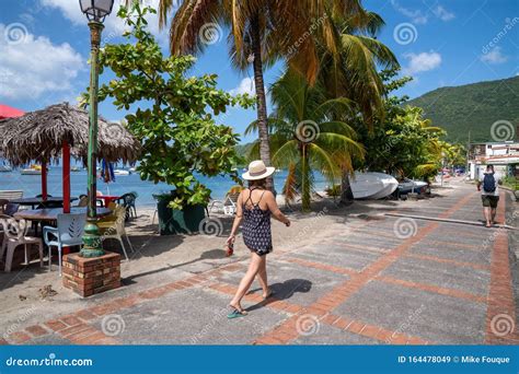 Woman Walking In Creole Village In French Antilles Of Martinique Stock