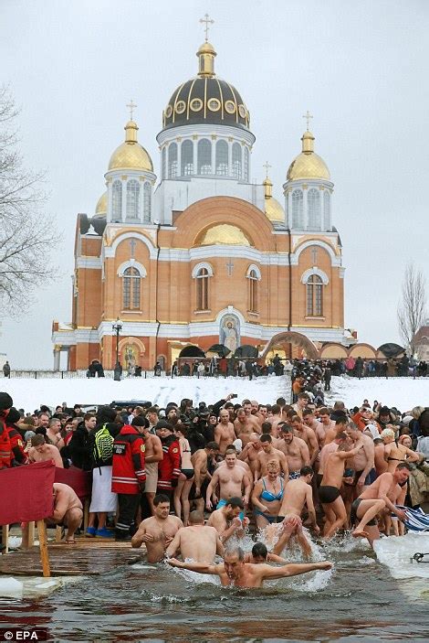 Orthodox Christians Bathe In Icy Waters To Mark Epiphany Daily Mail