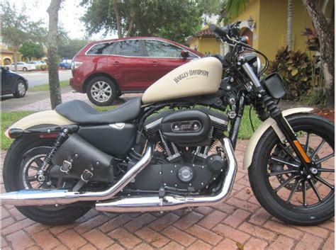 Sportsters traditionally have tall seats. Buy 2014 Harley-Davidson Sportster 883 IRON on 2040-motos