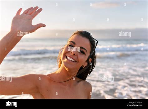 Spain Asturias Beautiful Young Woman On The Beach At Sunset Stock