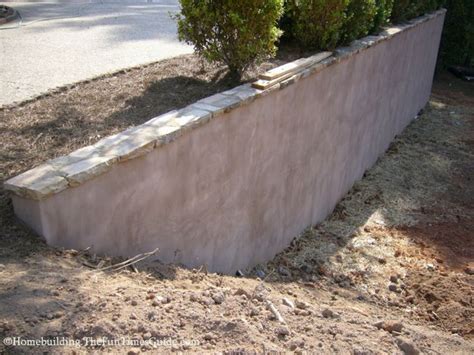 The interlocking bricks come prefinished, and. stucco retaining wall with flagstone cap - Google Search ...