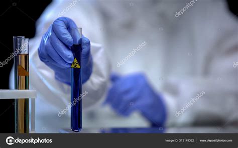 Toxic Lab Worker Showing Test Tube Biological Hazard Liquid Virus Stock