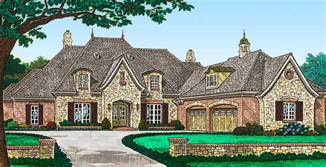 The spacious great room (which features a cozy fireplace) opens to the backyard via two sets of french doors. Luxury French Country House Plan with Four Car Garage ...