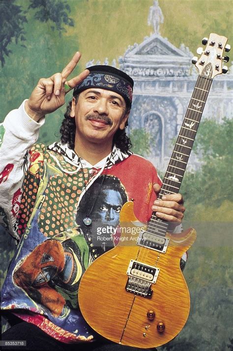 Photo Of Carlos Santana Posed Studio At Rockwalk Induction Guitar