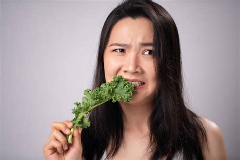 Women Eating Kale Stock Photos Pictures And Royalty Free Images Istock