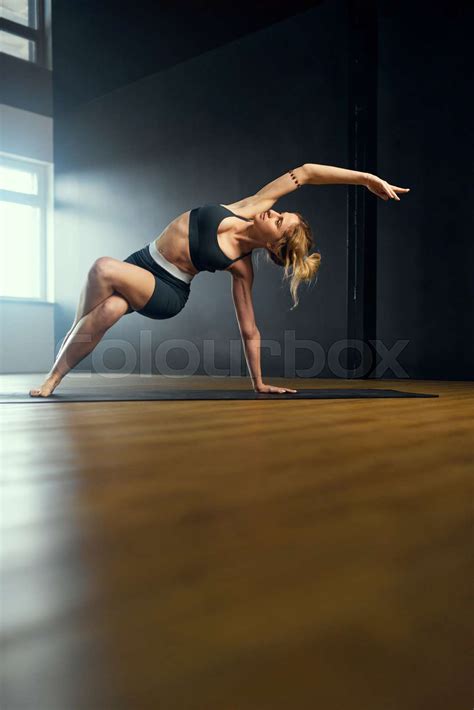 Young Woman Practicing Yoga In Studio Stock Image Colourbox