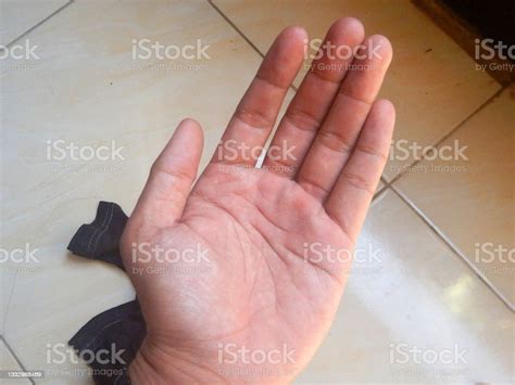 Mans Left Hand Photographed During The Day Photo Stock Photo Download