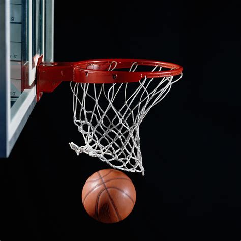 Basketball In Hoop By Ryan Mcvay