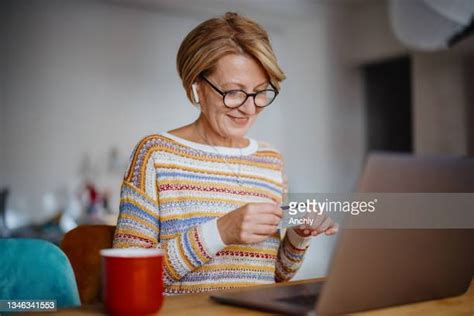 Mature Woman Celebrate Laptop Photos And Premium High Res Pictures Getty Images