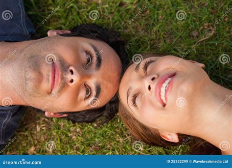 Close Up Of Two Friends Looking At Each Other While Lying Head T