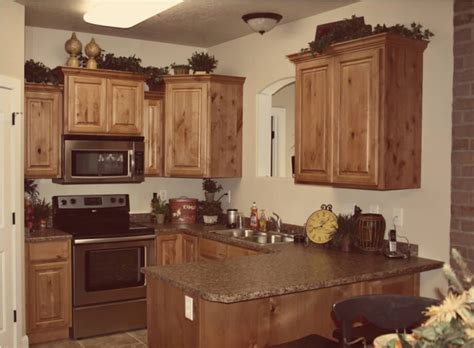 Kitchen cabinets, granite countertop, breakfast bar. Knotty Alder Cabinets With Ebony Stain - Loccie Better ...