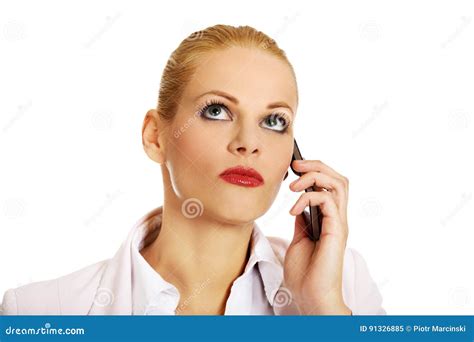 Serious Business Woman Talking Through A Mobile Phone Stock Image