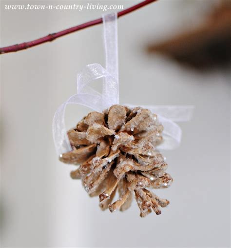 Diy Bleached And Glittered Pine Cone Ornaments Town And Country Living