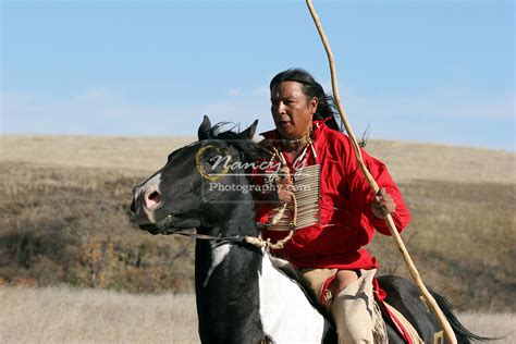 A Native American Sioux Indian Man Riding Horseback On A Indian Horse