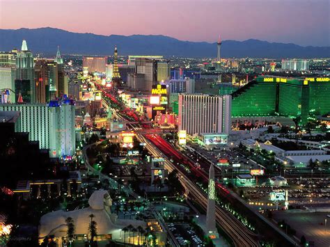 Download Astonishing Panoramic View Of Glittering Las Vegas Skyline At Night Wallpaper