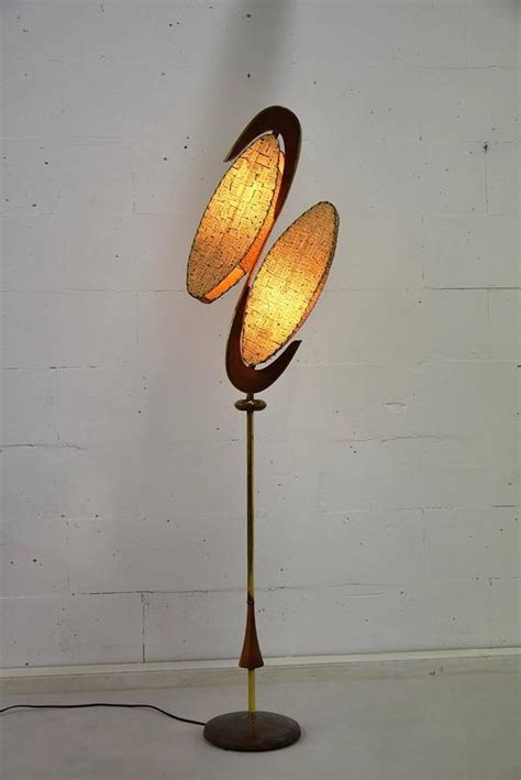 Brass has been cleaned and black parts repainted. Majestic Mid century Modern Floor Lamp For Sale at 1stdibs