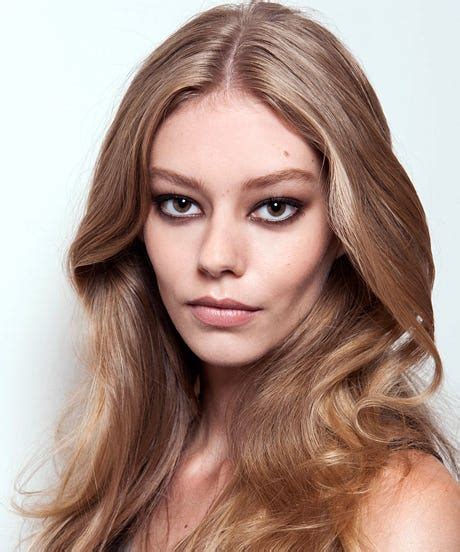 This is all about a sleek, straight part typically seen on long hair. Middle Part Hair Style Trend