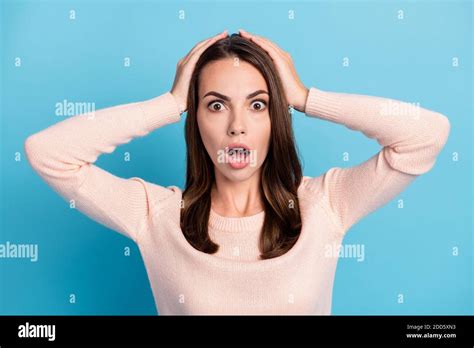 Portrait Of Astonished Anxious Girl Touch Hand Head Open Mouth Isolated Over Blue Pastel Color