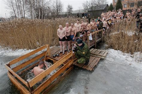 Russian Orthodox Christians Plunge Into Icy Rivers And
