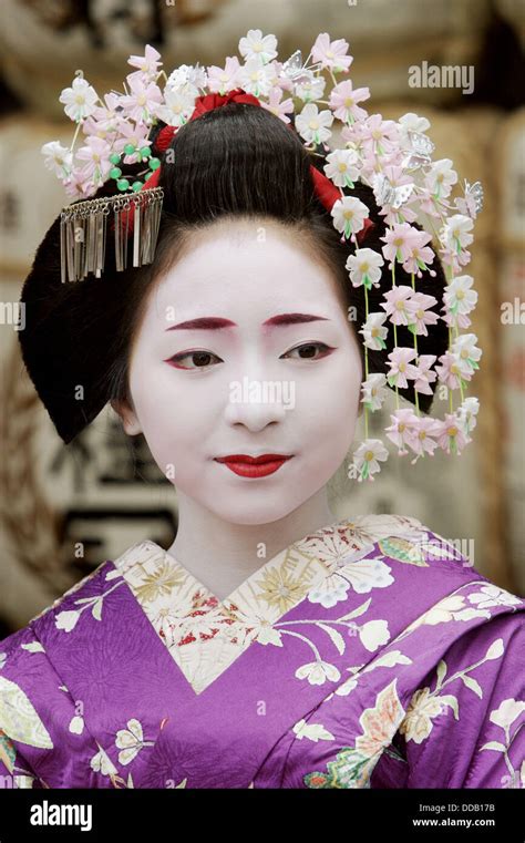 Geisha In Traditional Make Up And Wearing A Kimono In The Gion District Of Kyoto Japan Stock