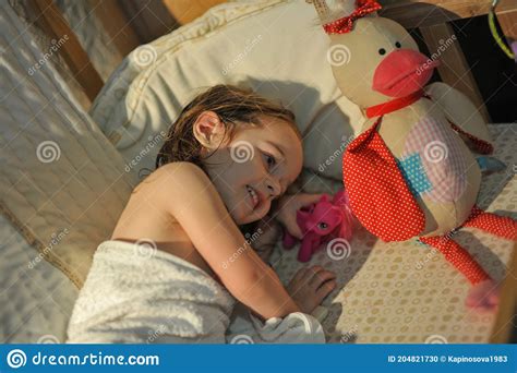 The Little Girl Goes To Bed In A Bed The Little Girl Goes Stock Photo