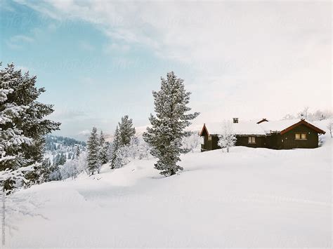 White Winter Snow Covered Cabin And Landscape In Scandinavia Del