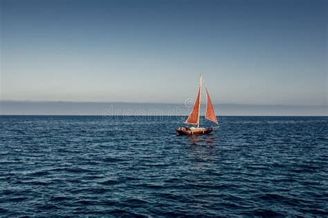 Yacht With A Red Sail In The Sea Stock Photo Image Of Nautical Mood