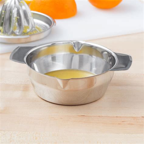 Cut the fruit in half. Stainless Steel Citrus Juicer / Reamer with Bowl