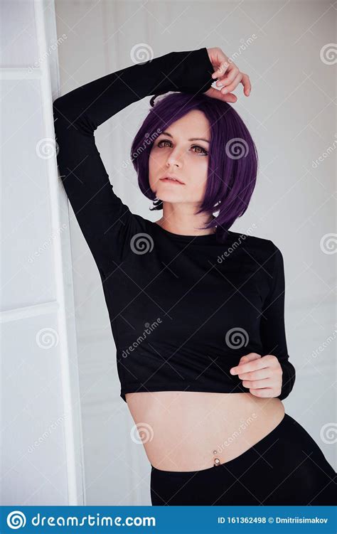 Portrait Of A Beautiful Woman Anime Cosplayer With Purple Hair Stock
