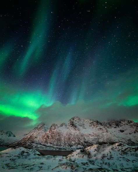 Aurora Borealis Storm Above Snowy Lofoten Peaks Lofoten Islands