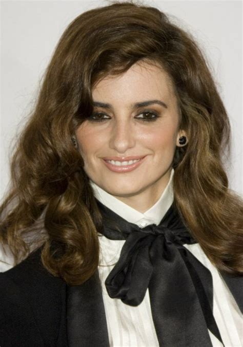 Penélope Cruz With Long Curly Hair And Wearing A Tux Outfit