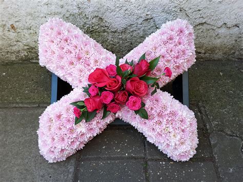 We did not find results for: Pink based 'X' funeral tribute with a darker pink floral ...
